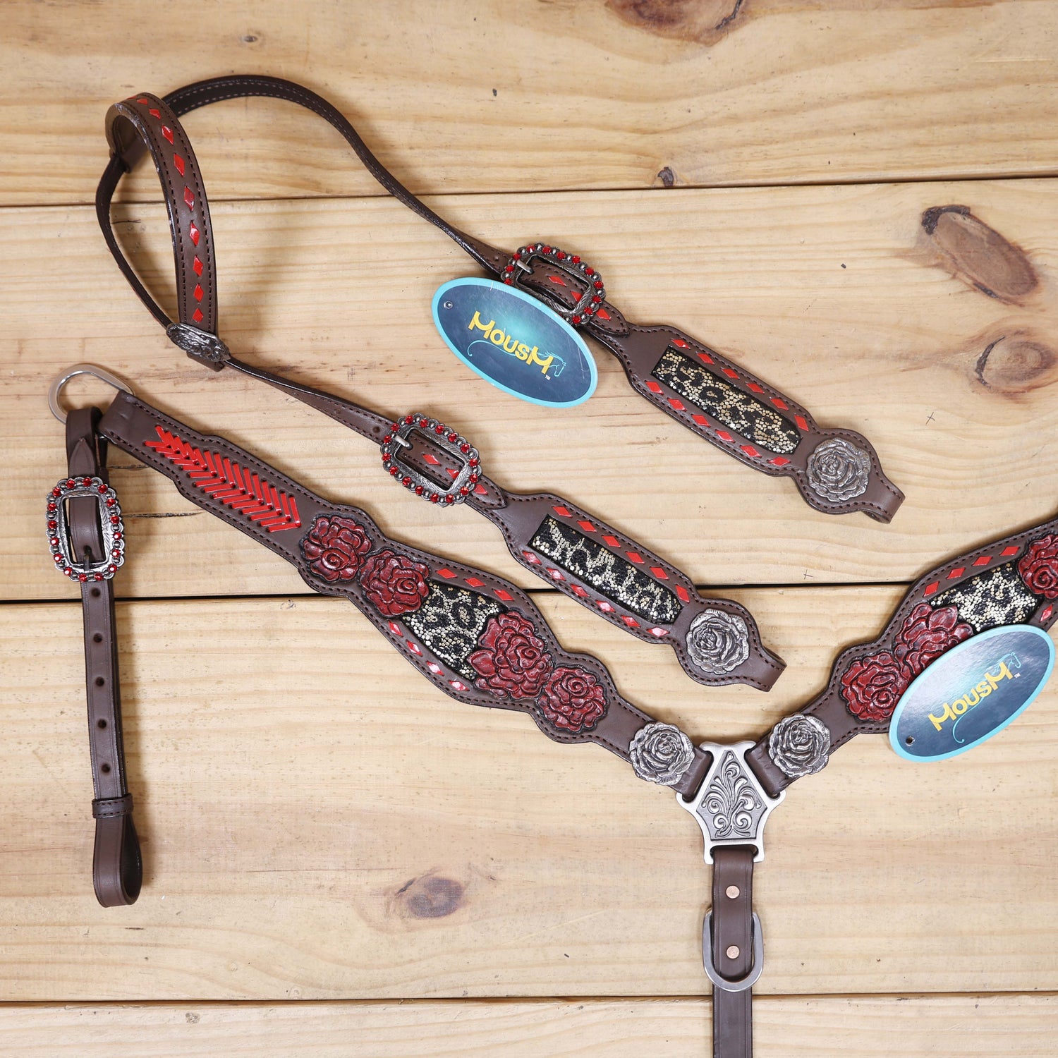 Western tack set featuring red rawhide arrow braiding and rose carving