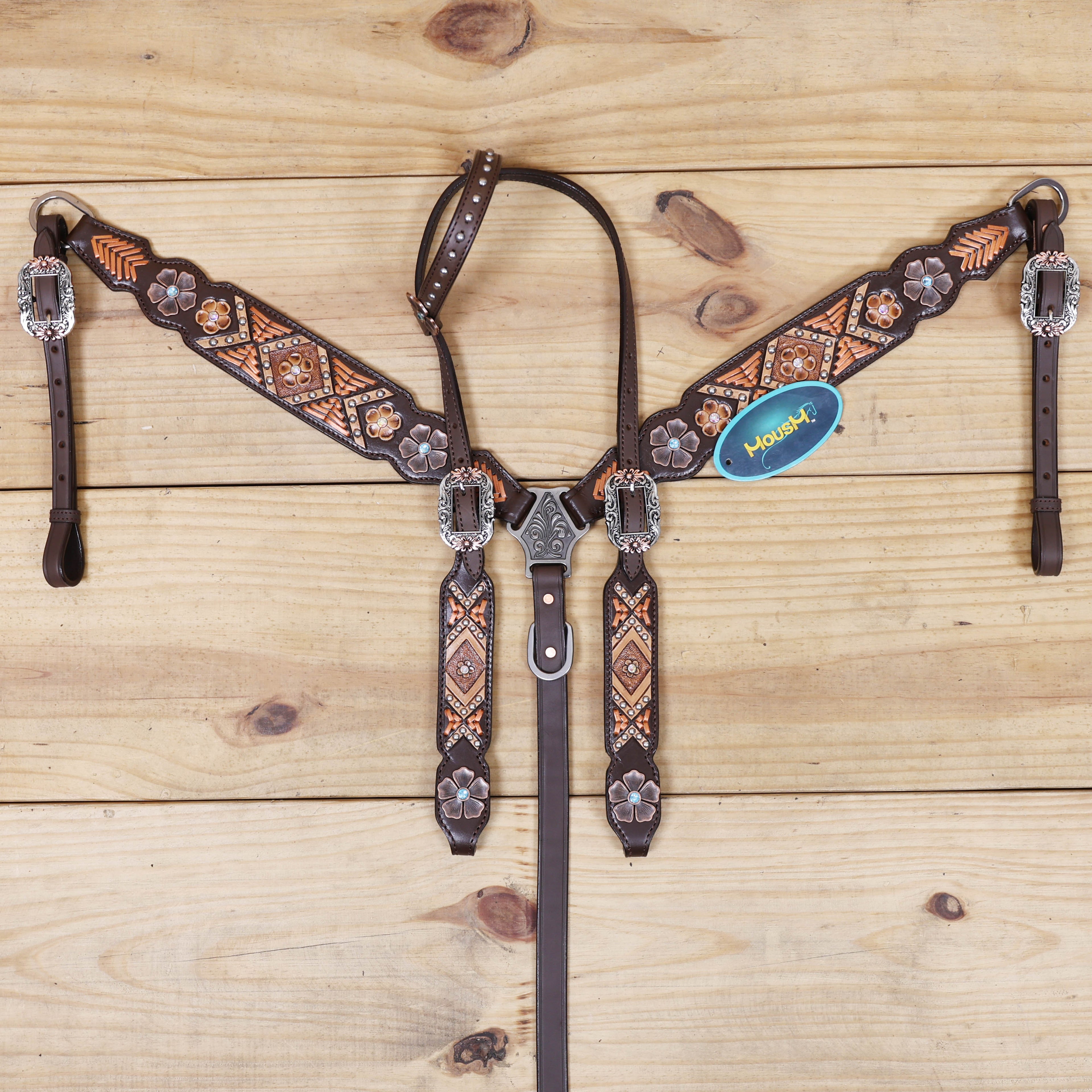 horse headstall breast collar with copper rawhide braiding and flower conchos
