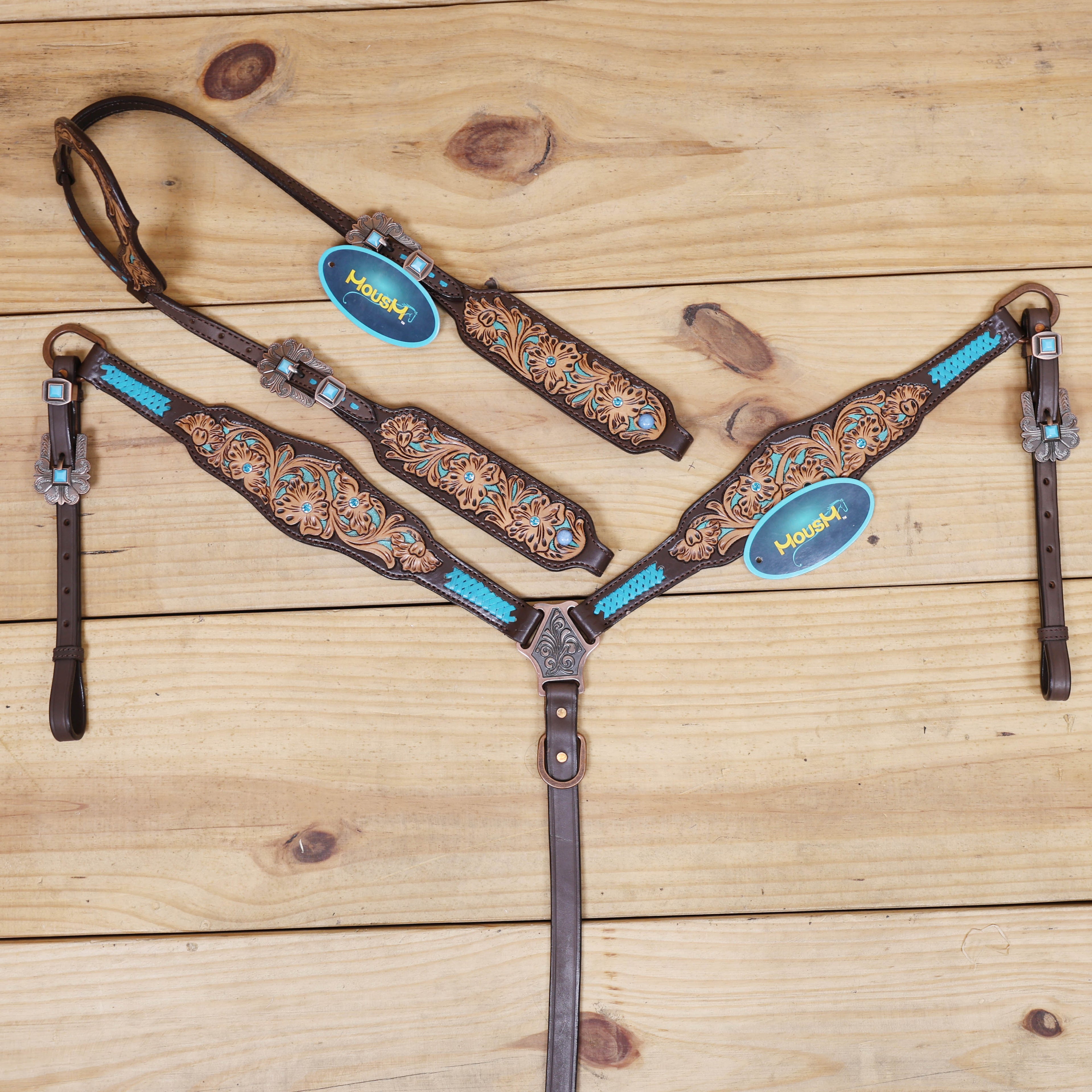 western headstall tack set with flower filigree carving and criss cross rawhide braiding