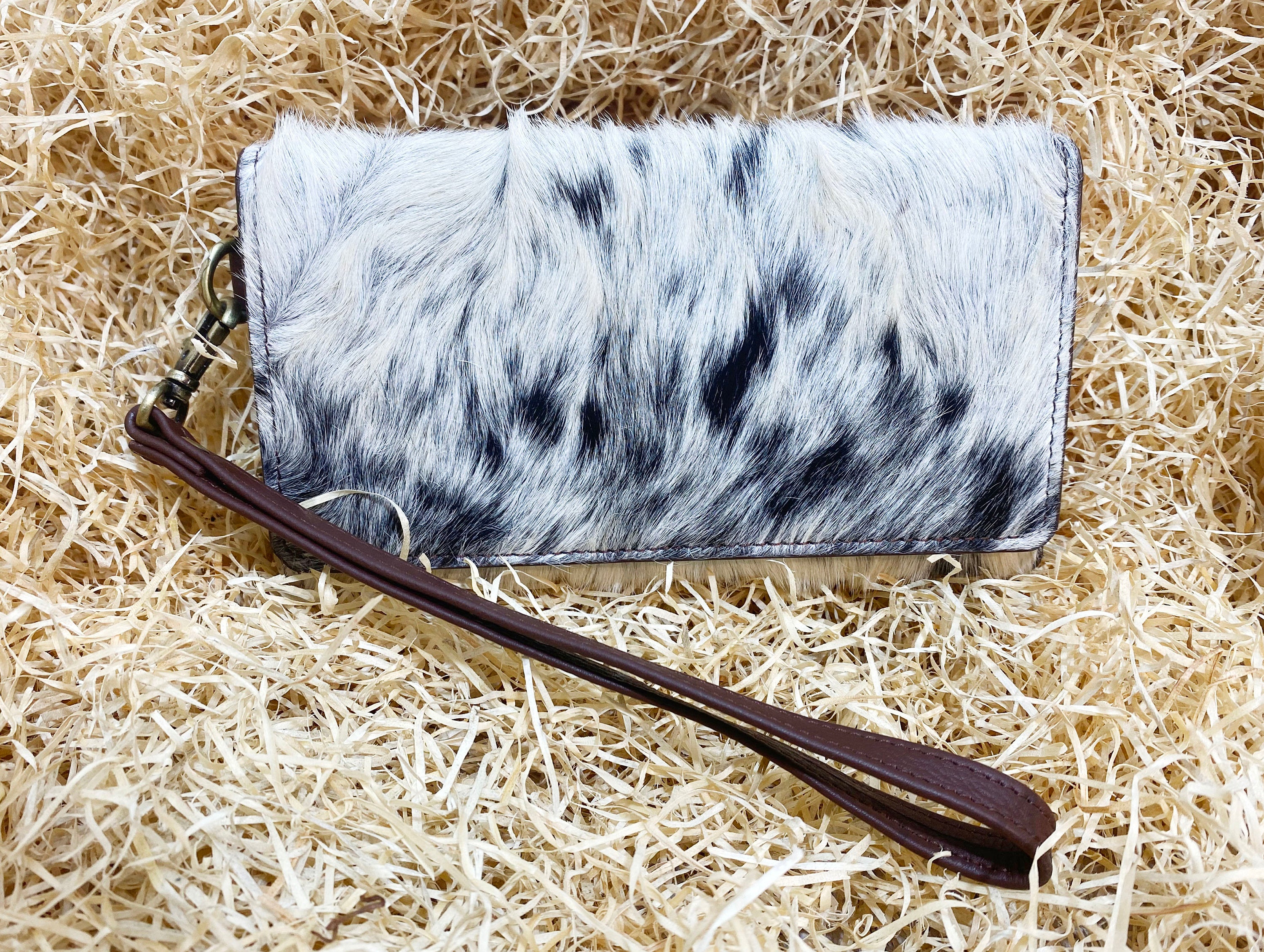 ladies clutch bag comes with real cow hairon overlay. Western Ladies hand clutch bag | Premium leather clutch bag by Mousm