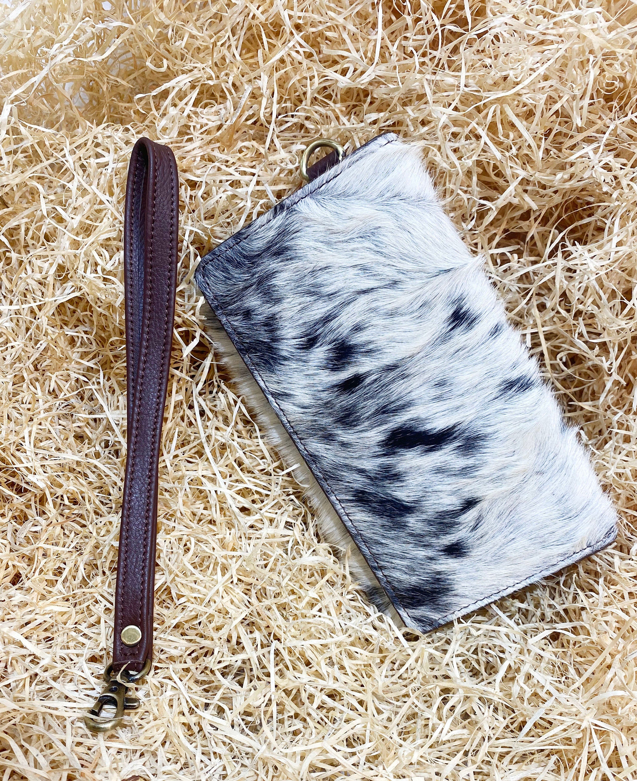 ladies clutch bag comes with real cow hairon overlay. Western Ladies hand clutch bag | Premium leather clutch bag by Mousm