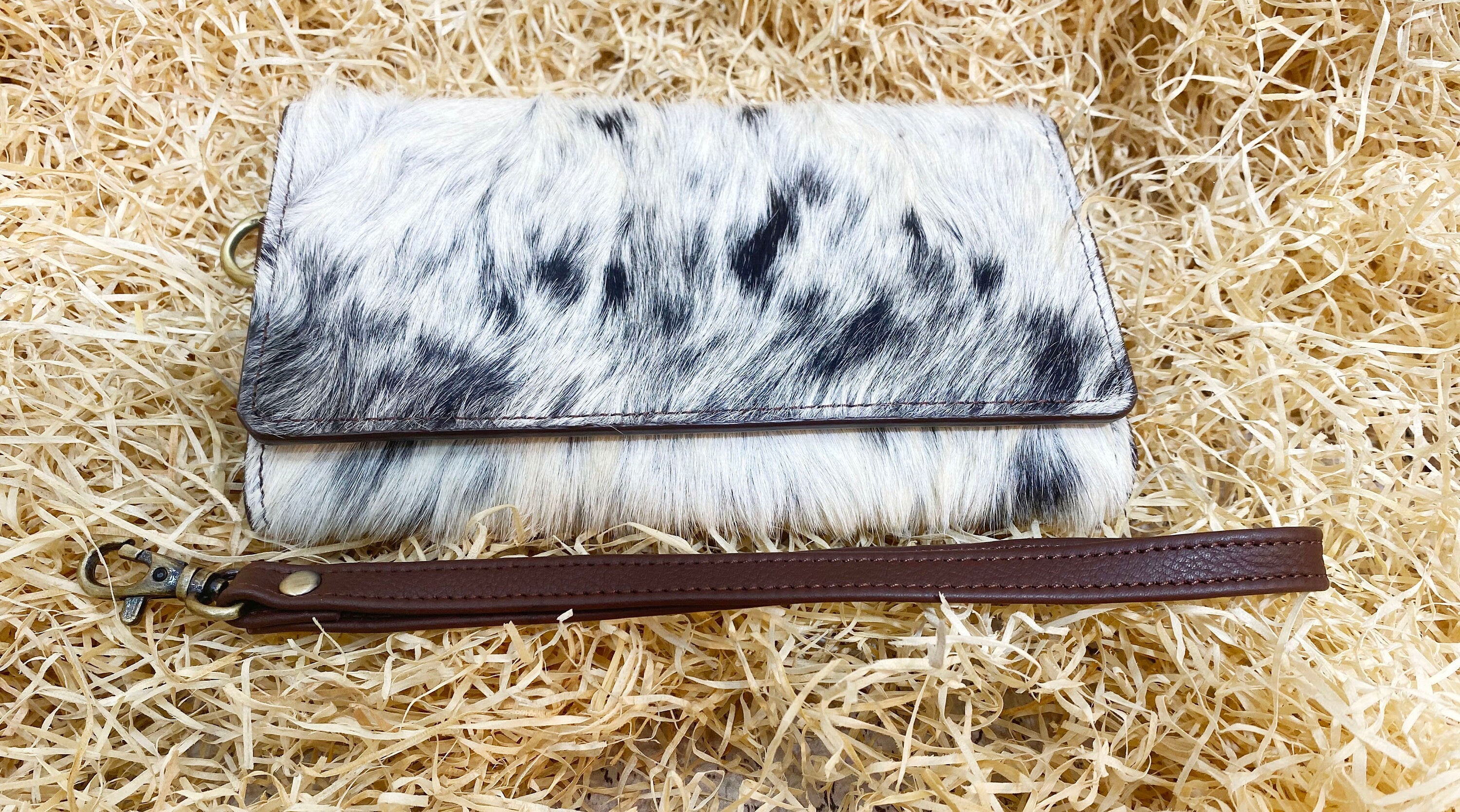 ladies clutch bag comes with real cow hairon overlay. Western Ladies hand clutch bag | Premium leather clutch bag by Mousm