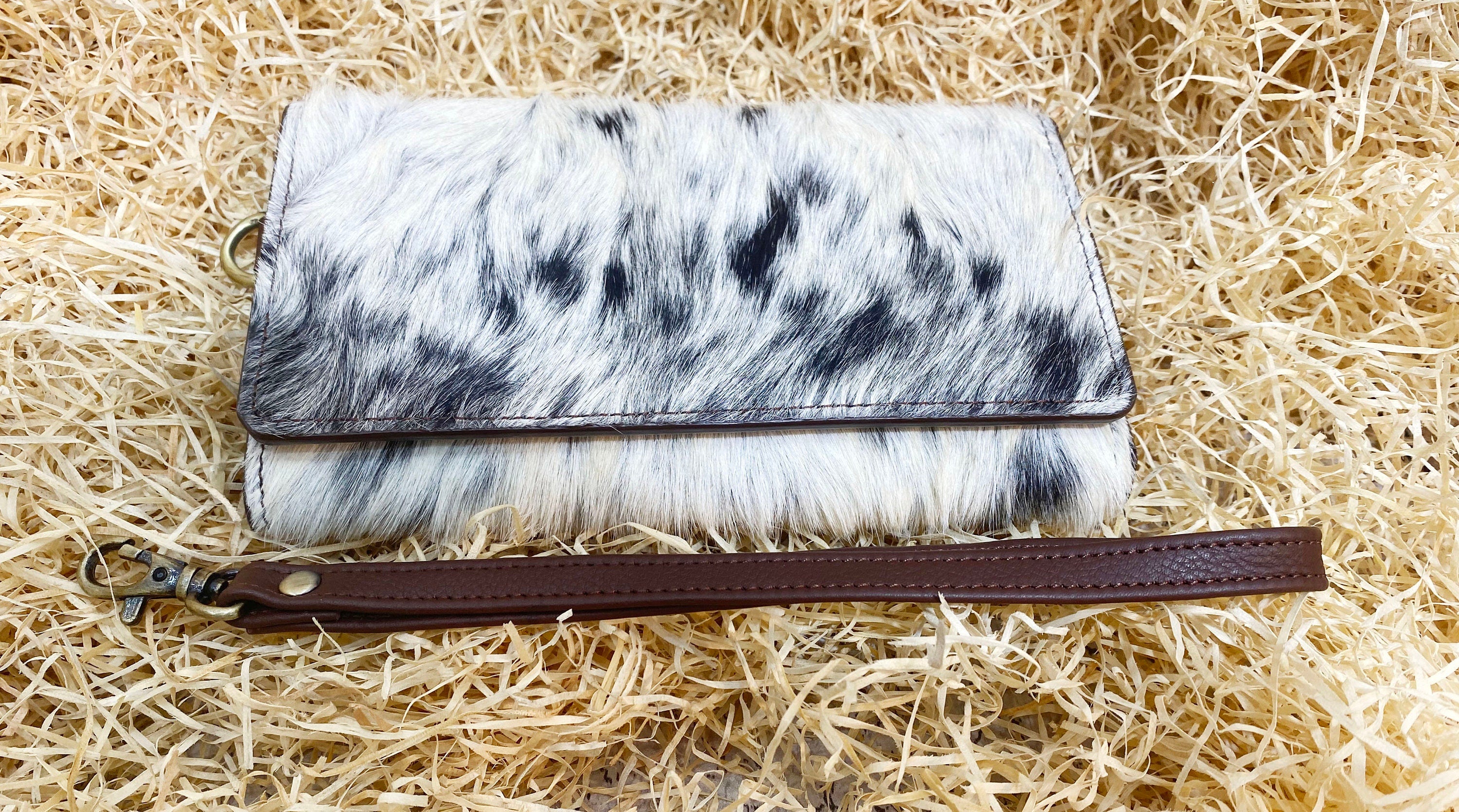 ladies clutch bag comes with real cow hairon overlay. Western Ladies hand clutch bag | Premium leather clutch bag by Mousm