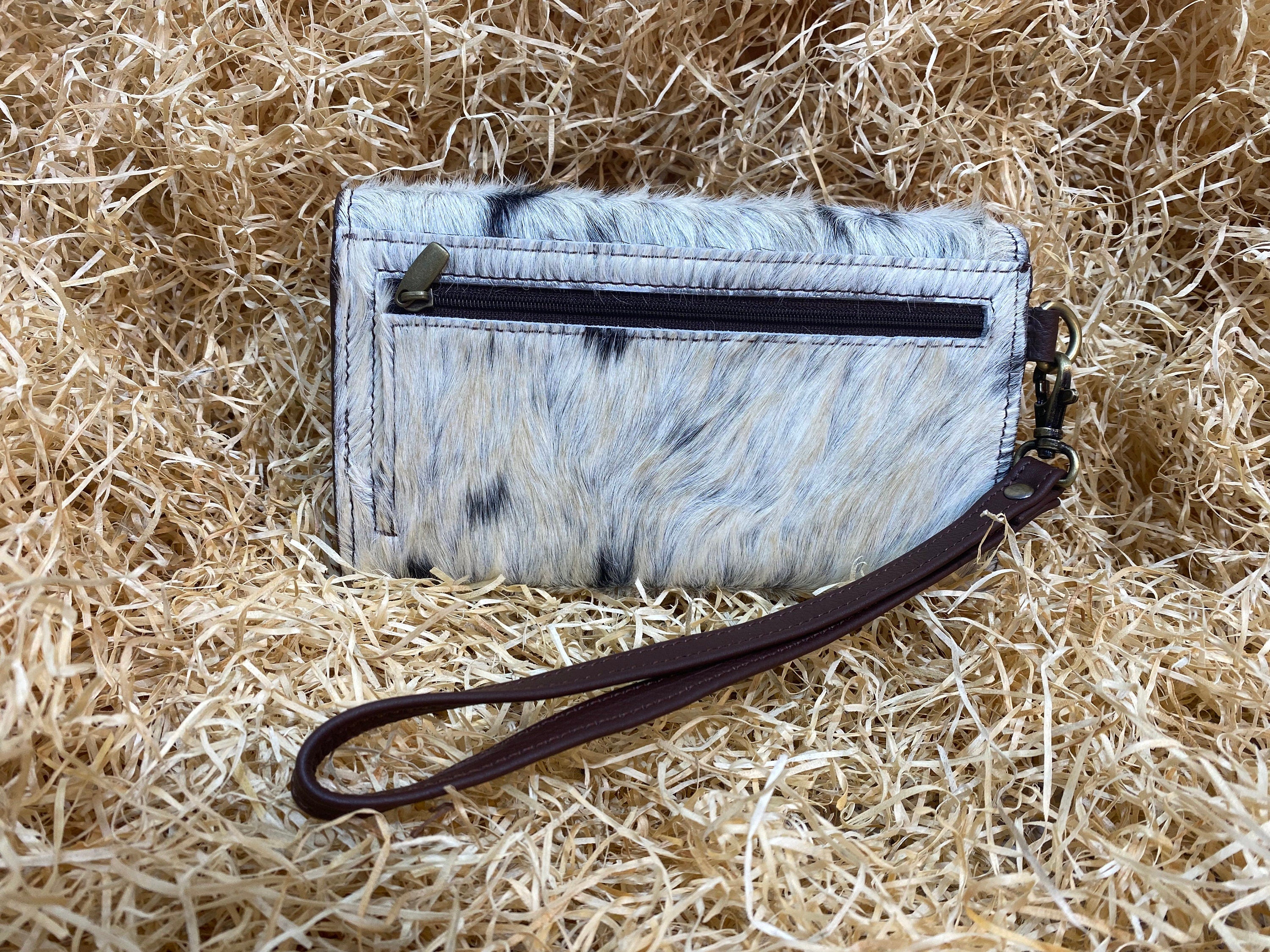 ladies clutch bag comes with real cow hairon overlay. Western Ladies hand clutch bag | Premium leather clutch bag by Mousm
