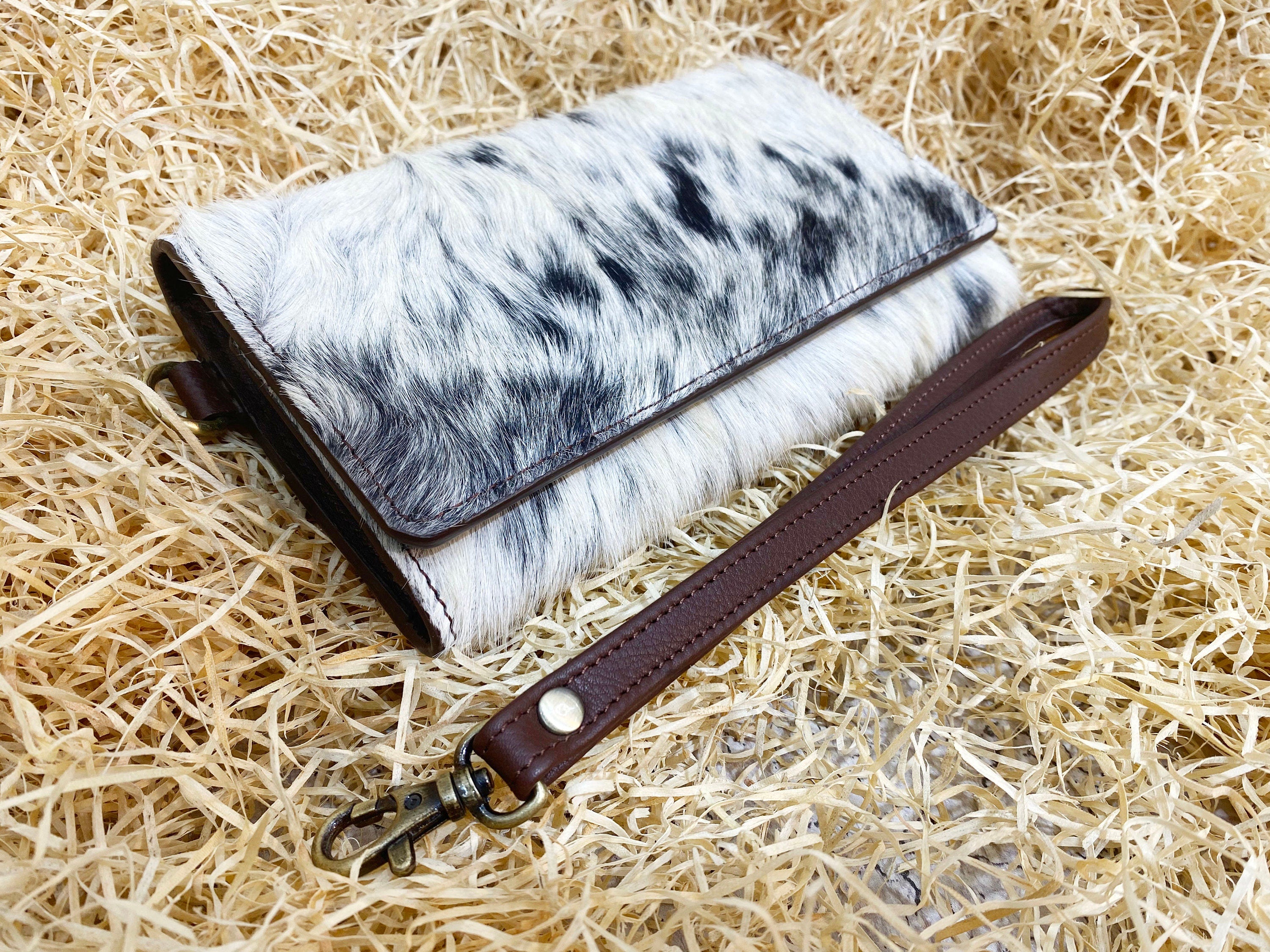 ladies clutch bag comes with real cow hairon overlay. Western Ladies hand clutch bag | Premium leather clutch bag by Mousm