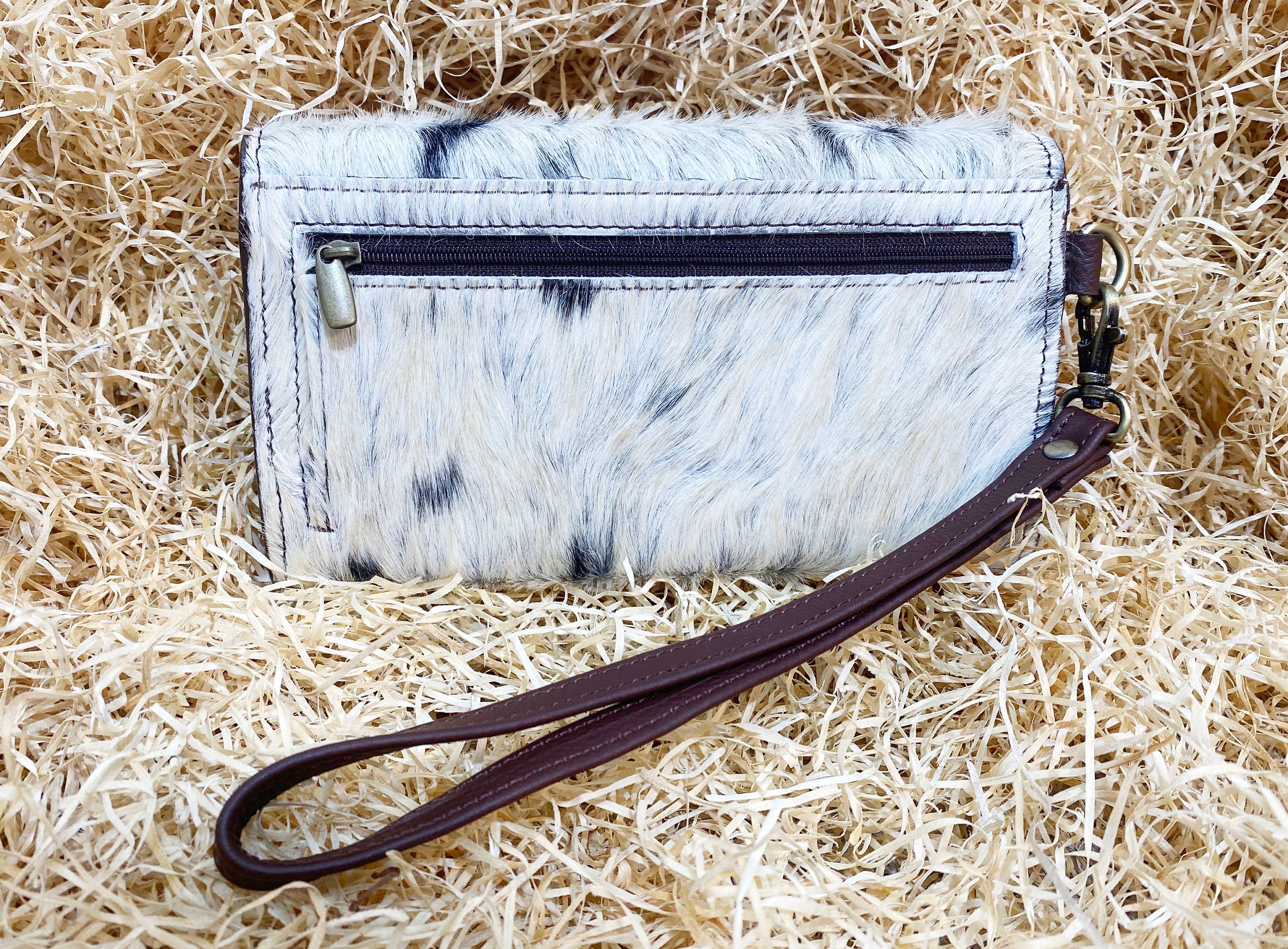 ladies clutch bag comes with real cow hairon overlay. Western Ladies hand clutch bag | Premium leather clutch bag by Mousm