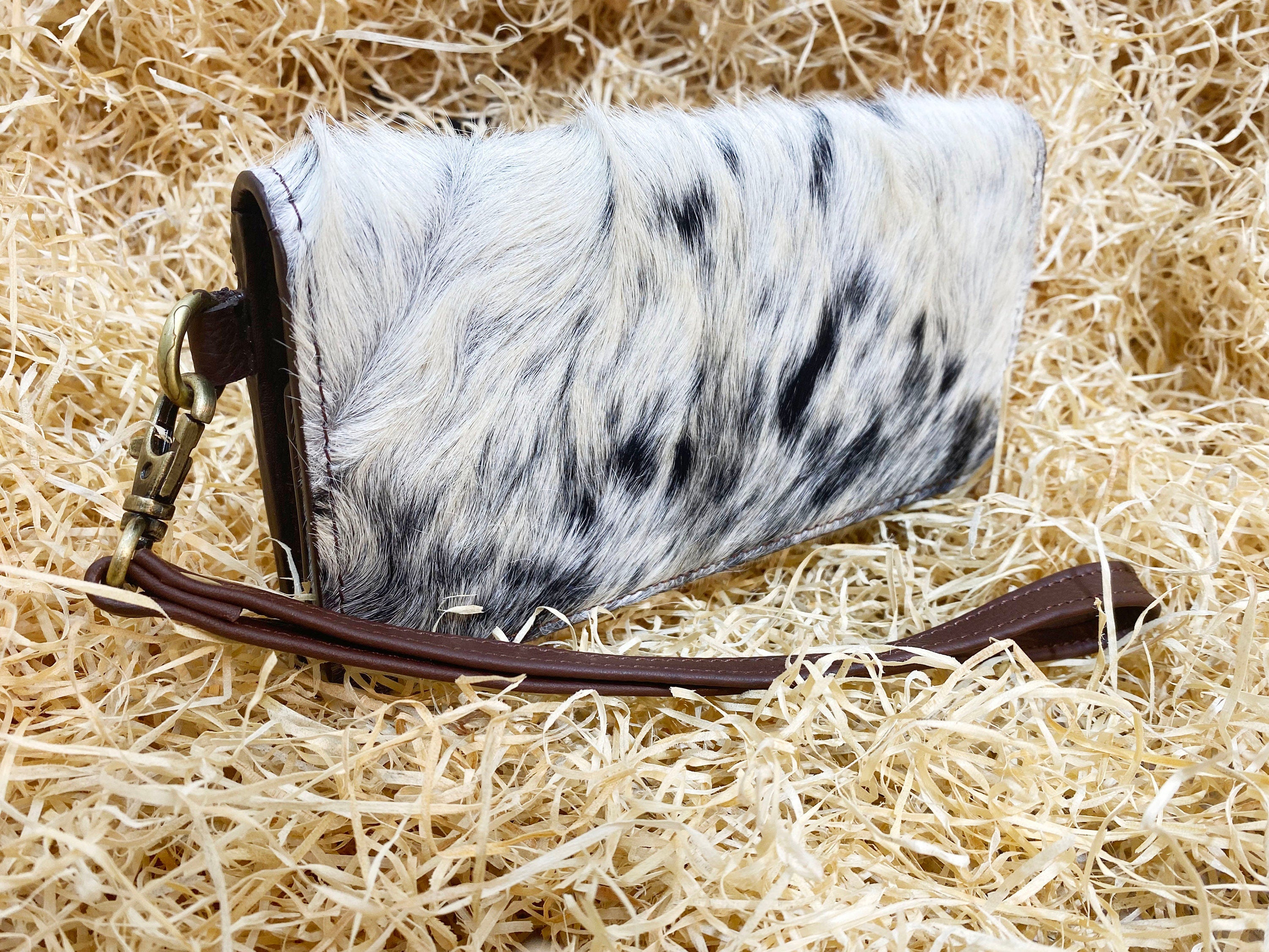 ladies clutch bag comes with real cow hairon overlay. Western Ladies hand clutch bag | Premium leather clutch bag by Mousm