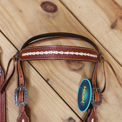 Western browband style headstall set featuring arrow-style rawhide braiding and antique nickel hardware