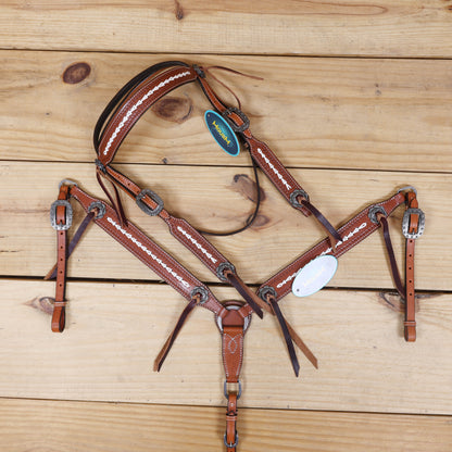 western leather headstall and breast collar set with burgundy leashes and basket tooling
