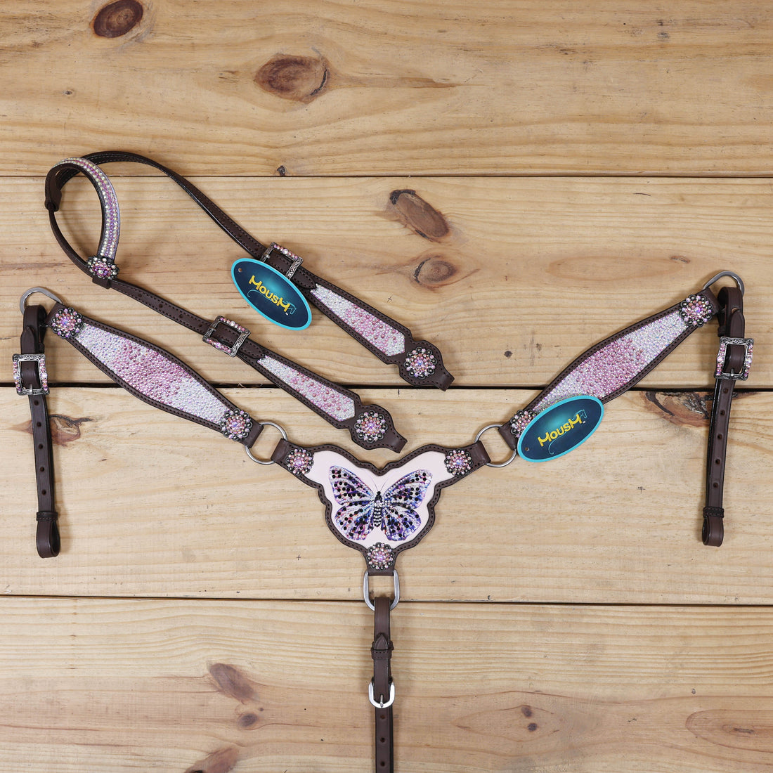 handcrafted headstall set with butterfly print, pink and holographic dazzle stones, and berry conchos