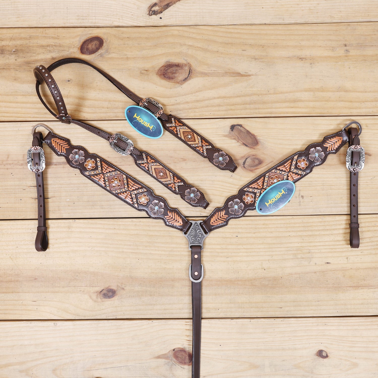 headstall with arrow style copper raw hide braiding and geometric flower carving on breastcollar