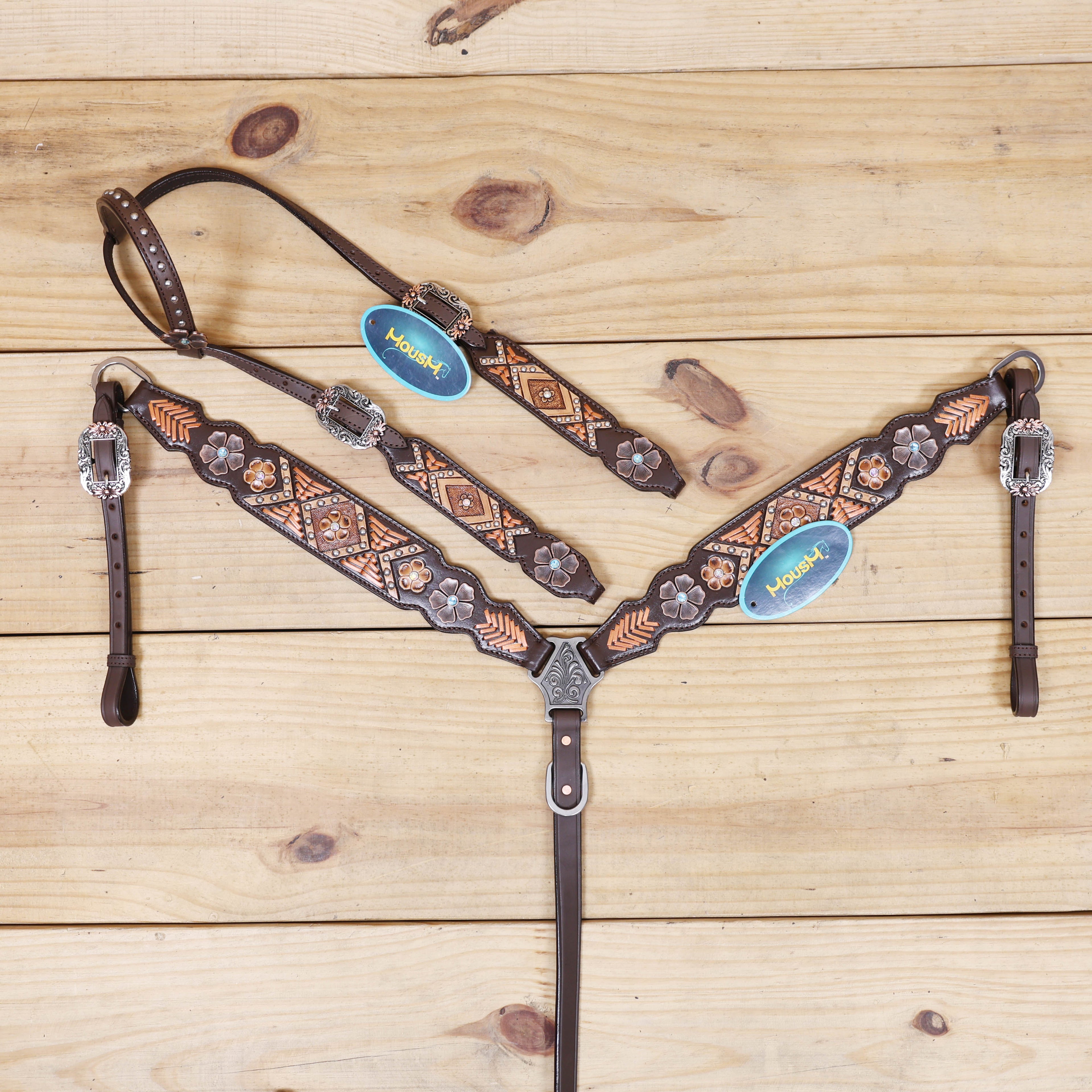 headstall with arrow style copper raw hide braiding and geometric flower carving on breastcollar