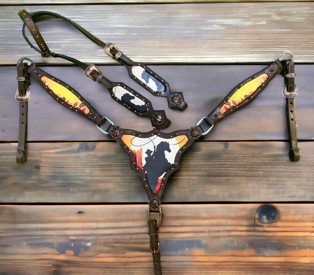 A set of Argentina cow leather Western horse tack, featuring a breast collar and bridle with a vintage bucking horse print and antique copper hardware, displayed on a wooden surface.