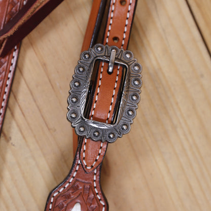 tack set with antique nickel buckles and rawhide braiding