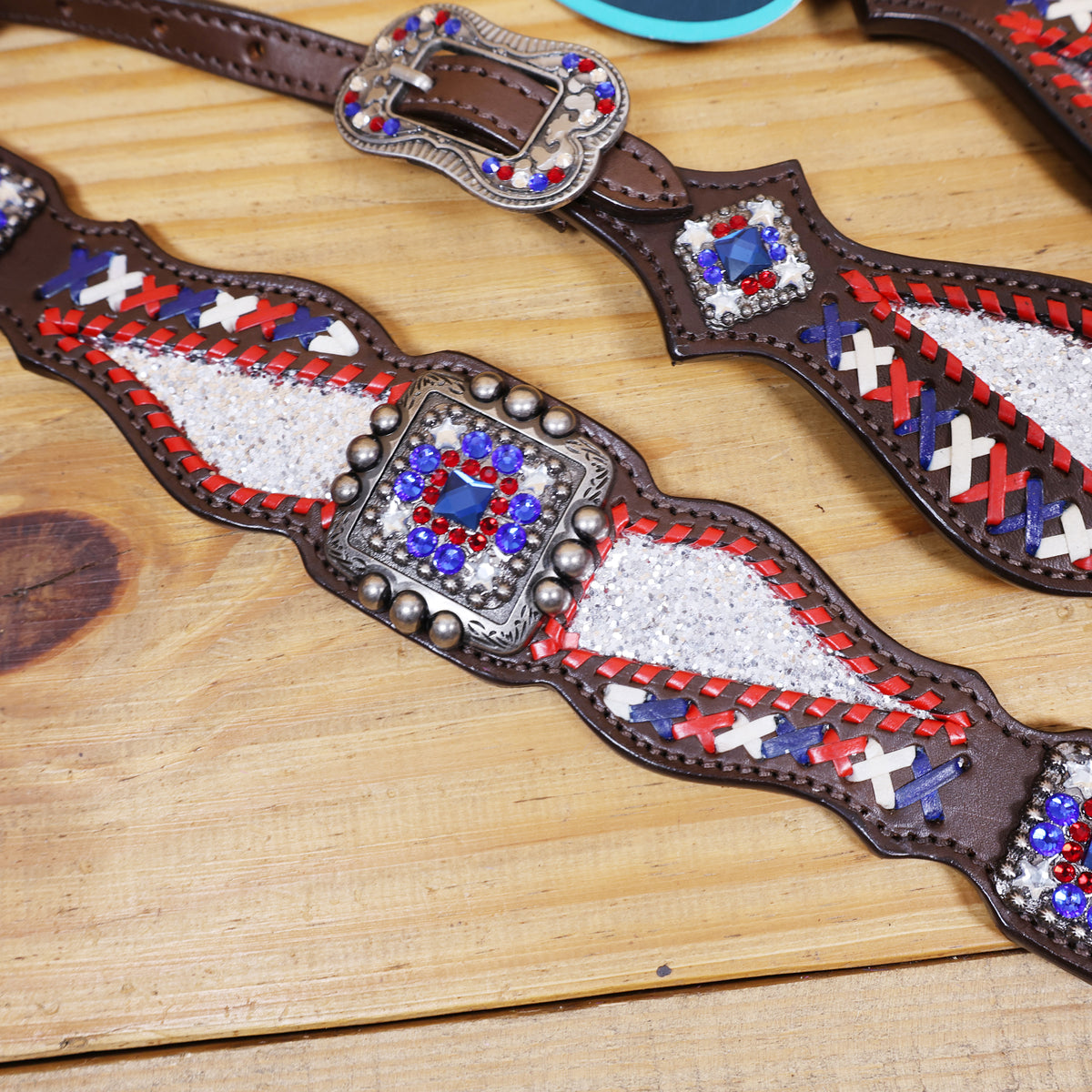 Western Leather Headstall and Breast Collar tack Set decorated with Patriotic Red Royal white stone conchos with silver glitter inlay and royal red ,white raw hide braiding