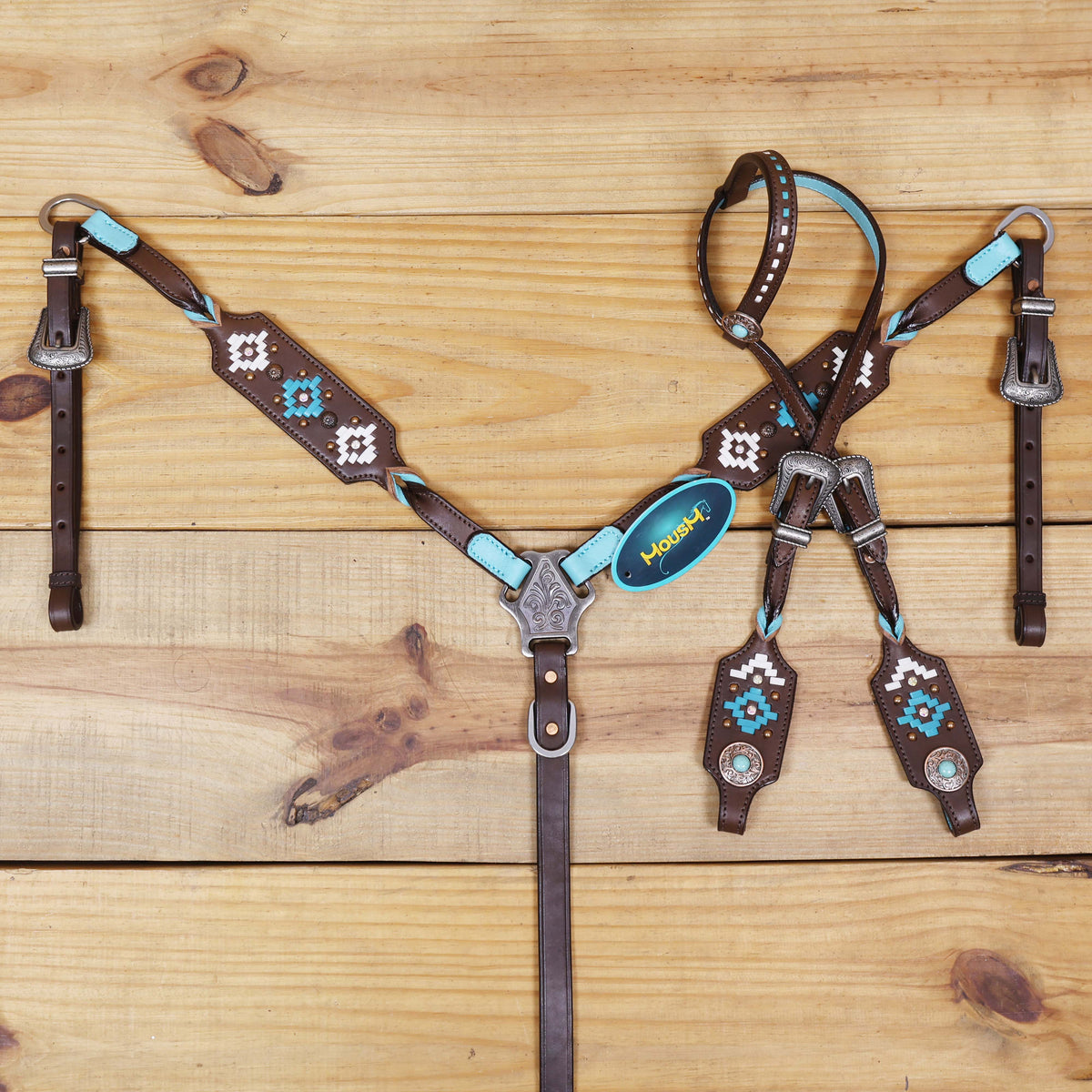 Western Leather Headstall and Breast Collar tack Set decorated with  Aztec-style rawhide braiding on breast collar and cheek pieces, and twisted braided breast collar and cheek piece