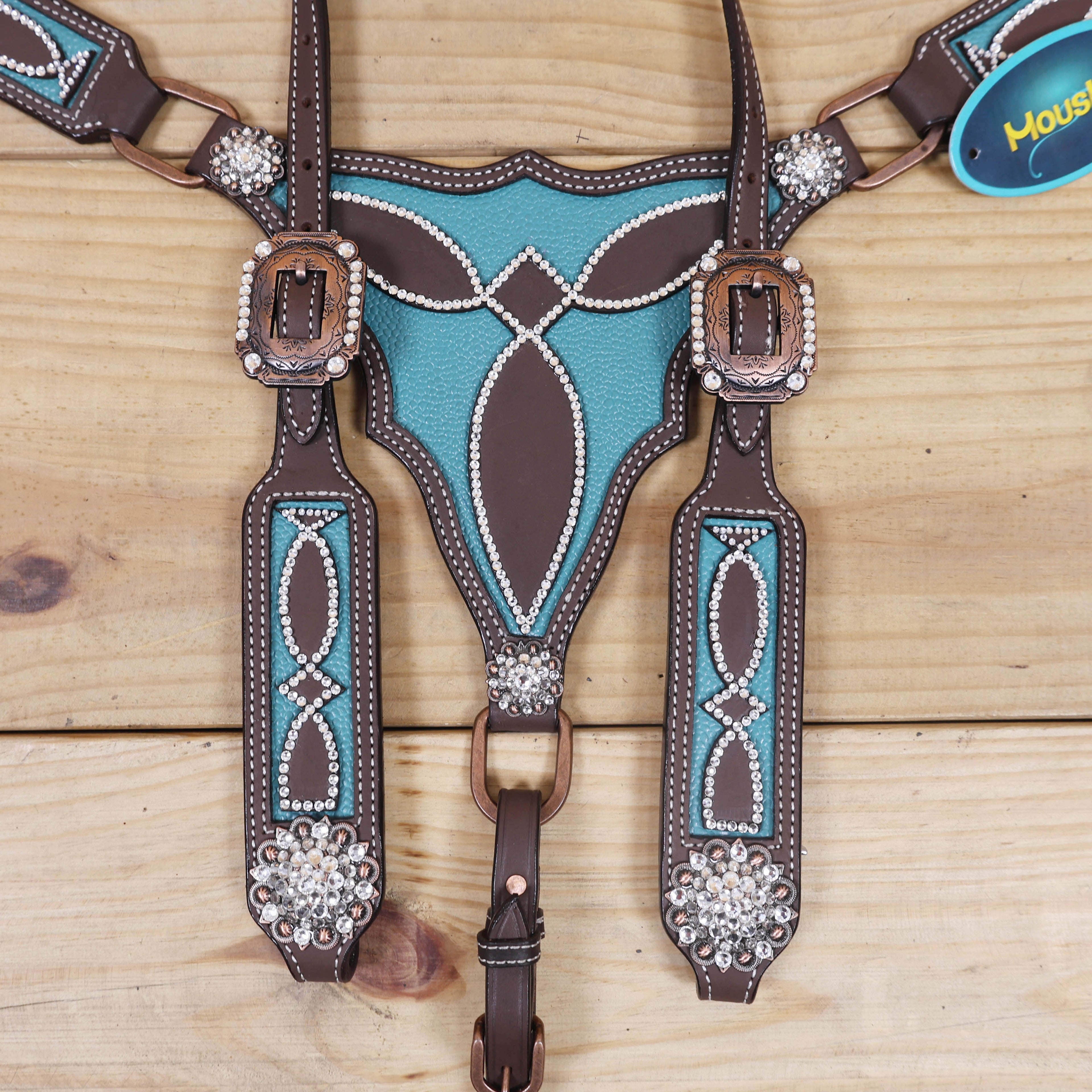 headstall cheekpieces decorated with clear stones and turquoise leather base with rhinestone berry conchos