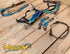 A set of Argentina cow leather horse tack including a headstall, breast collar, and other matching accessories, featuring a metallic turquoise holographic alligator print.