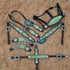 A set of Argentina cow leather Western horse tack including a headstall, breast collar, and other equipment decorated with a lime-green metallic acid wash cowhide finish and antique nickel hardware.