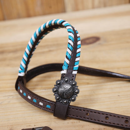 Western horse tack set with arrow style rawhide braiding and whip stitching with berry Conchos