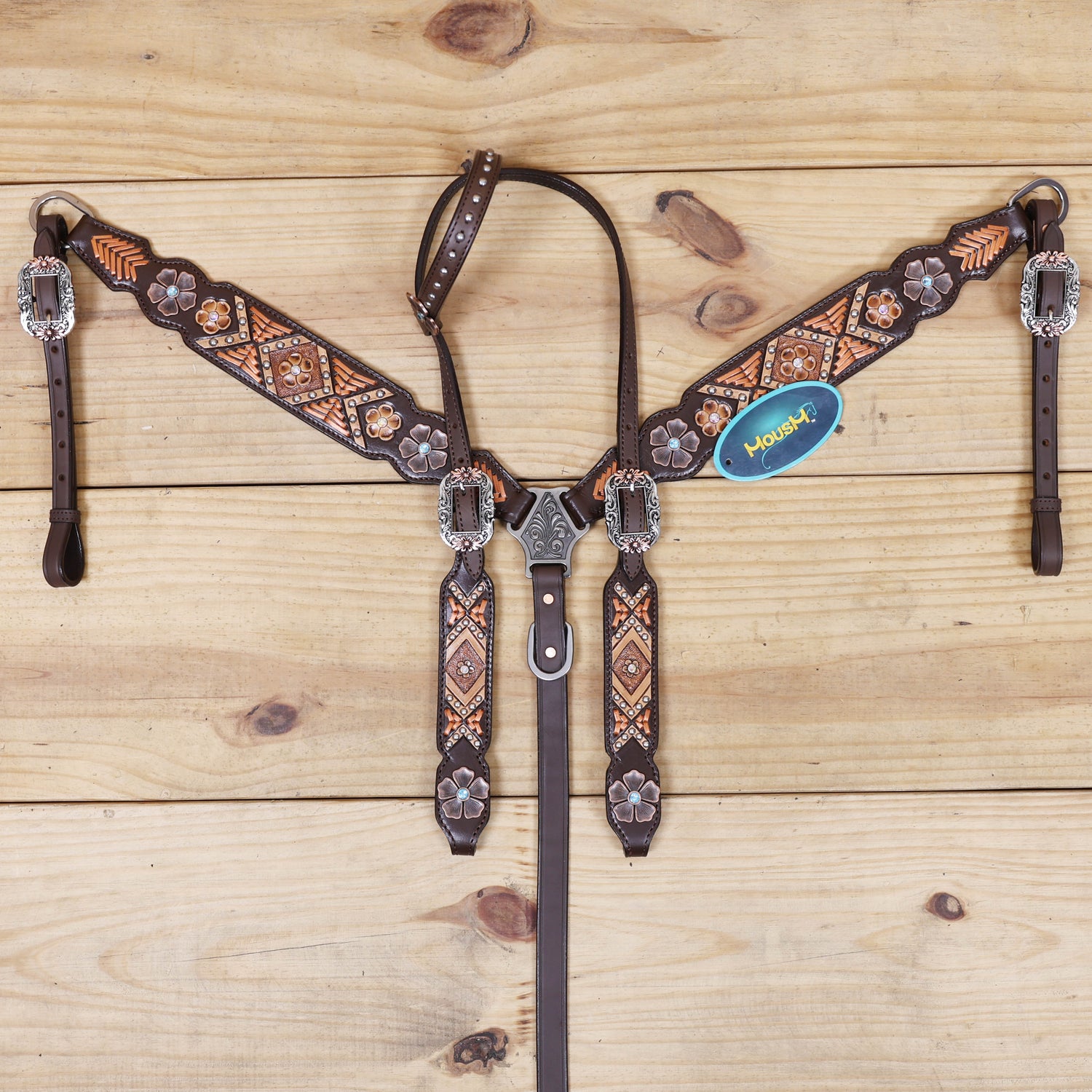 horse headstall breast collar with copper rawhide braiding and flower conchos