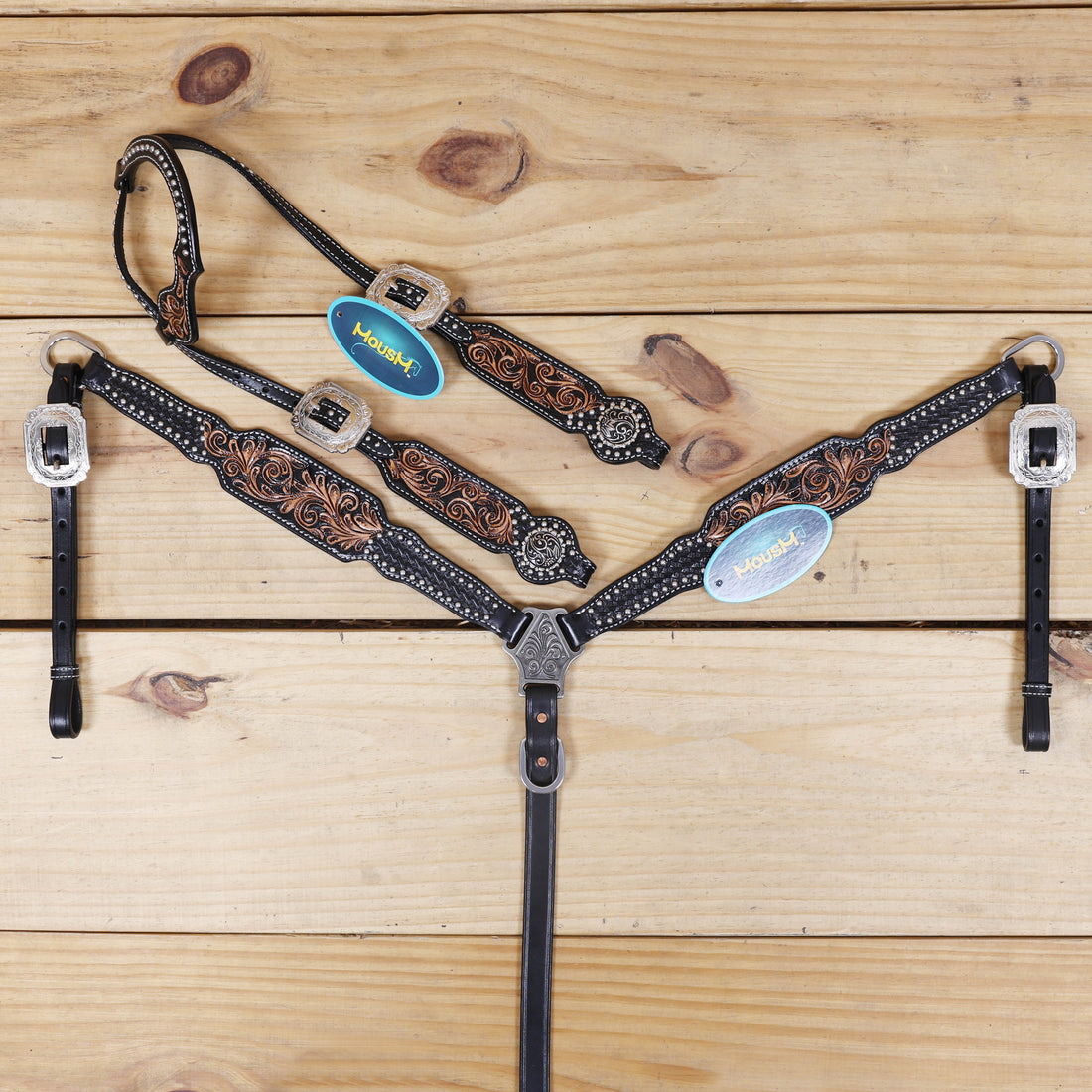 western leather headstall and breast collar set with hand-carved basket tooling and silver studs