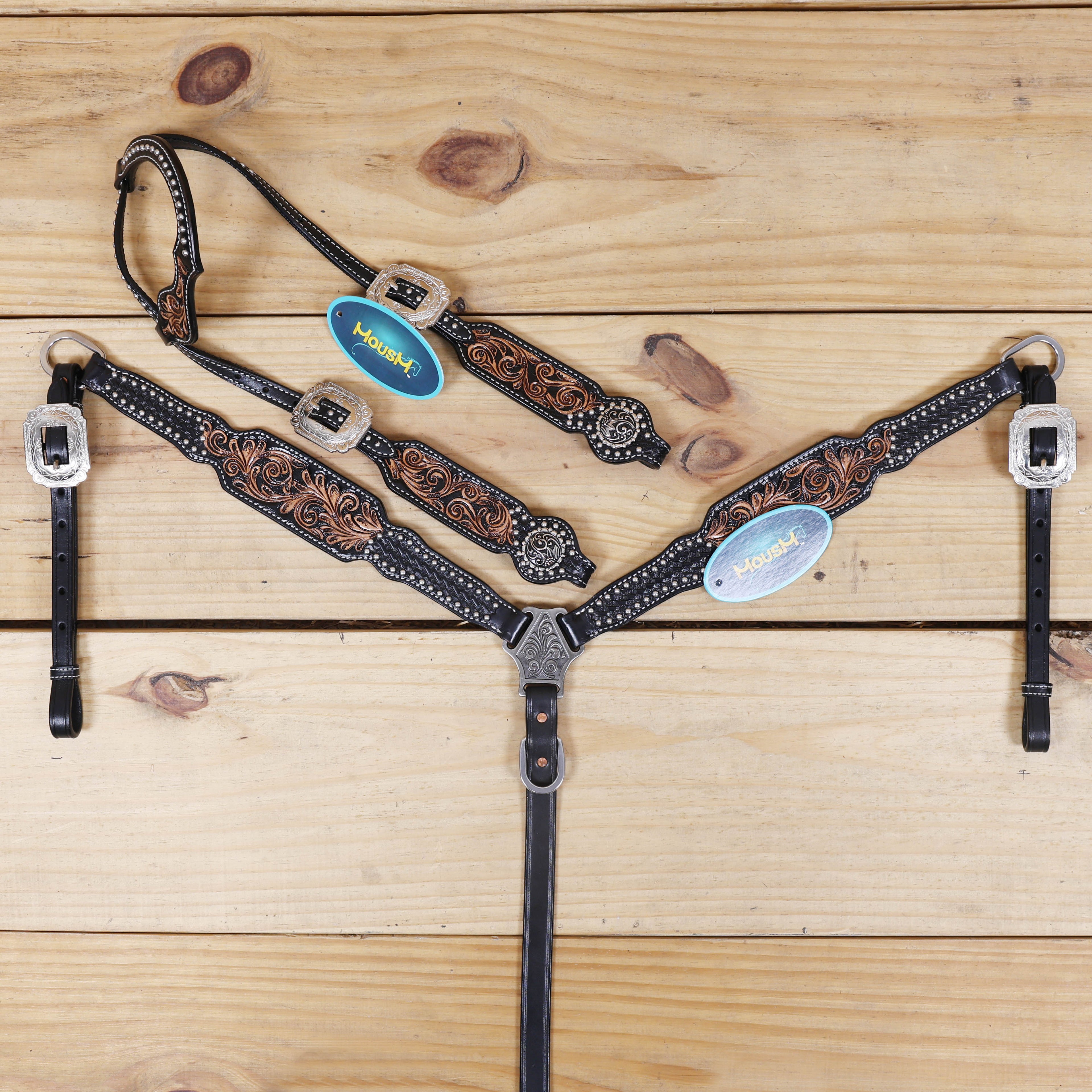 western leather headstall and breast collar set with hand-carved basket tooling and silver studs