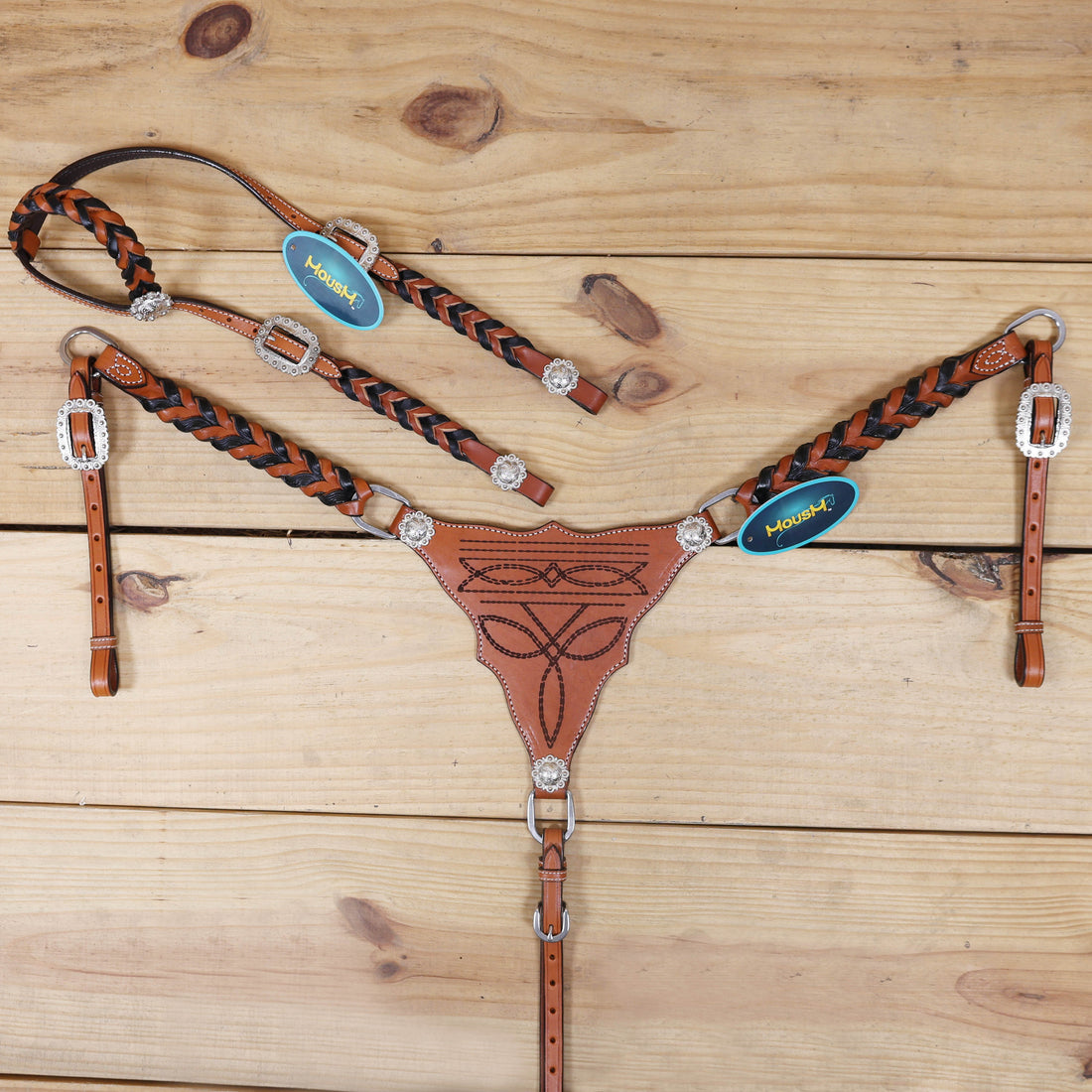 handcrafted Western headstall and breast collar set with cowboy boot engraving, twisted leather braiding on cheekpieces