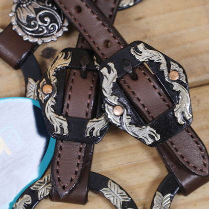 headstall and breast collar set with antique nickel hardware and copper rivet buckles and floral concho