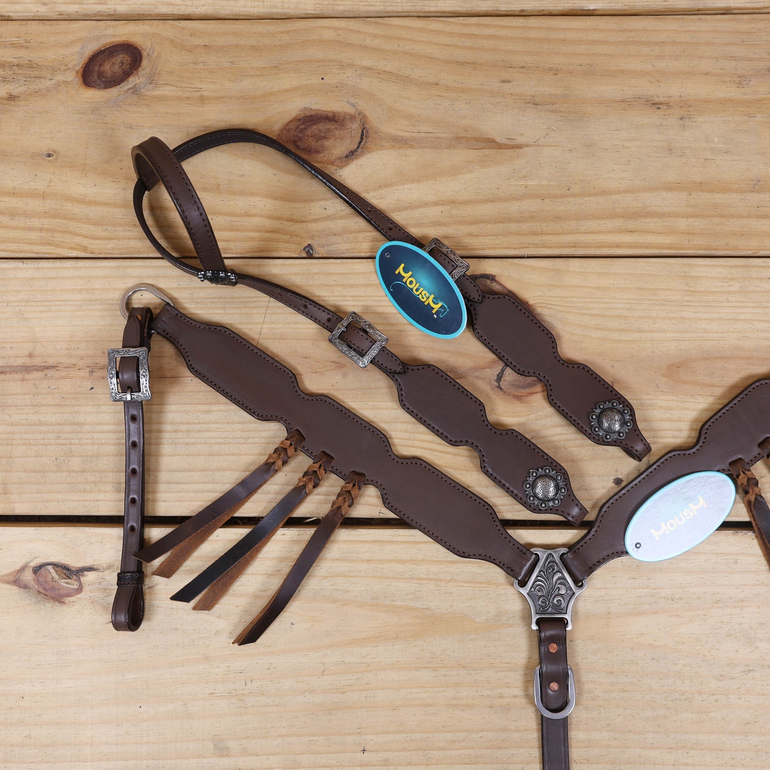 Western headstall and breast collar featuring plain brown leather and cherry braided accents