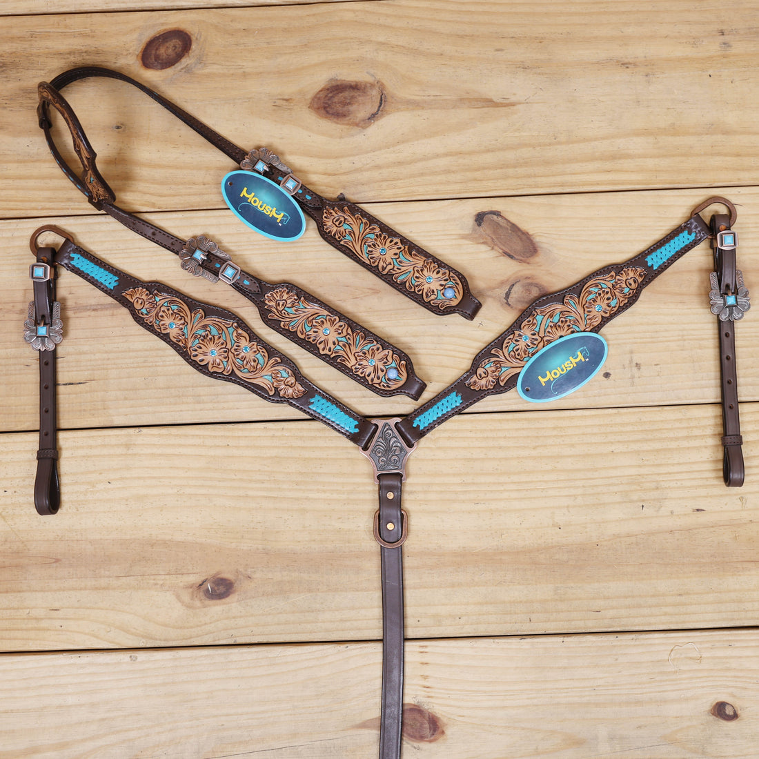western headstall tack set with flower filigree carving and criss cross rawhide braiding