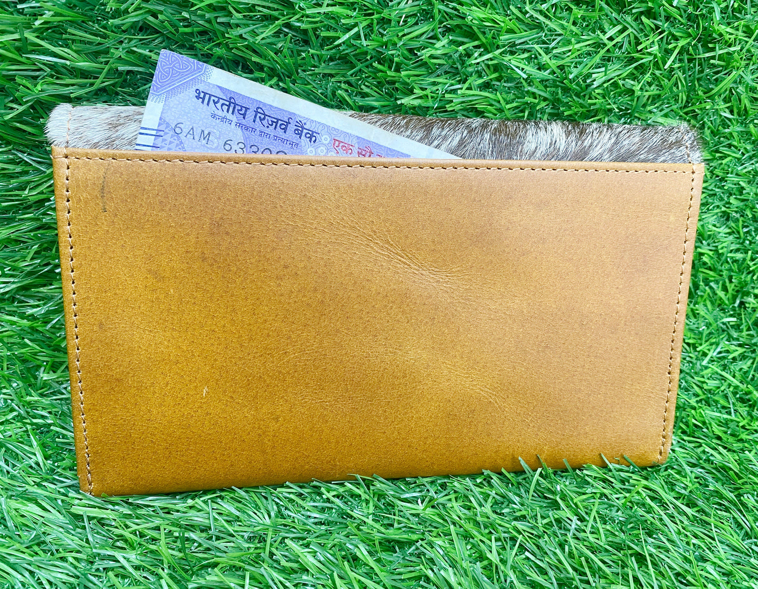 ladies clutch bag having natural cowhide pattern. Lady&
