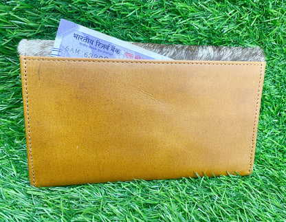 ladies clutch bag having natural cowhide pattern. Lady&