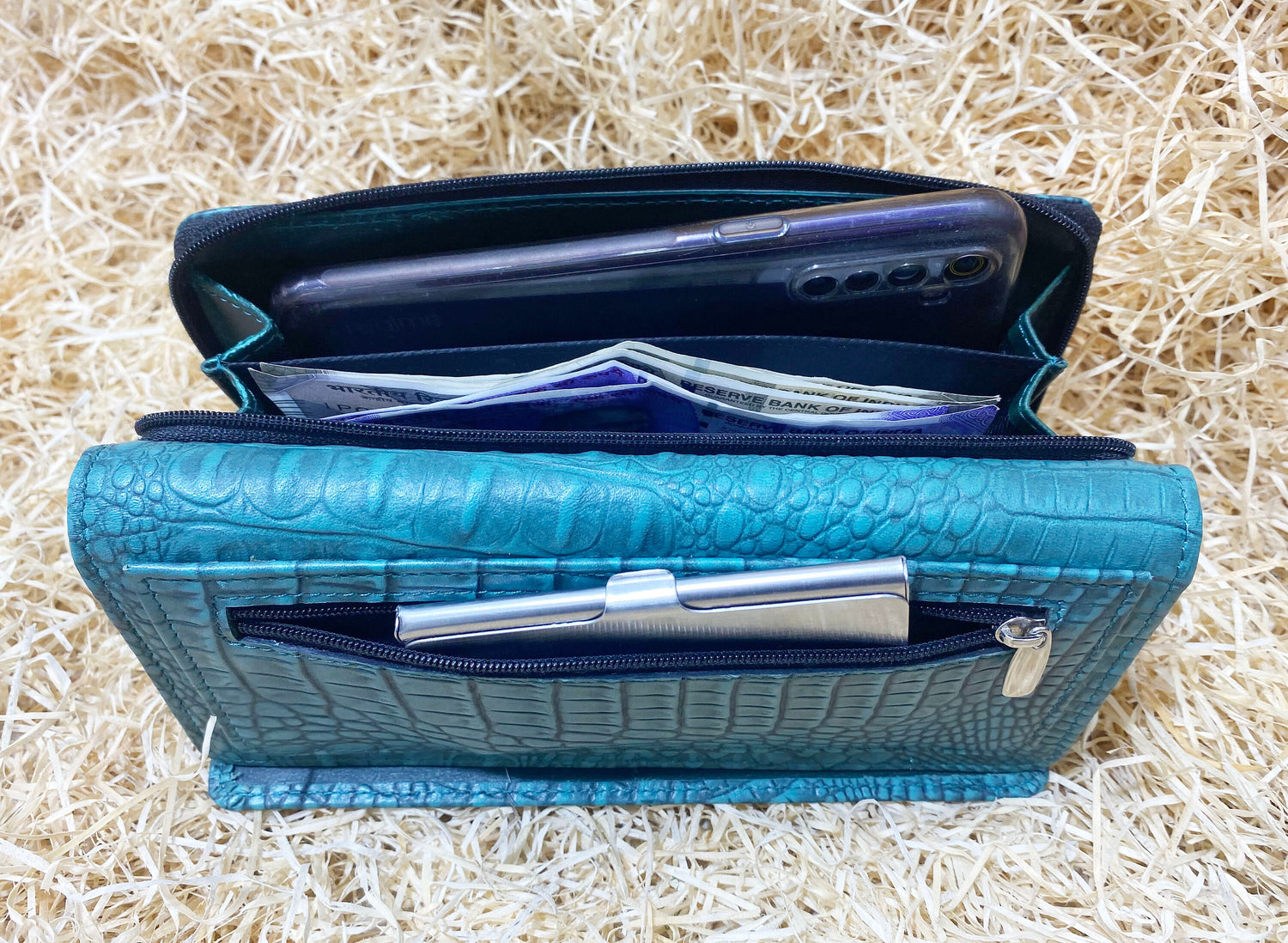 ladies clutch bag comes with turquoise leather print. Ladies&
