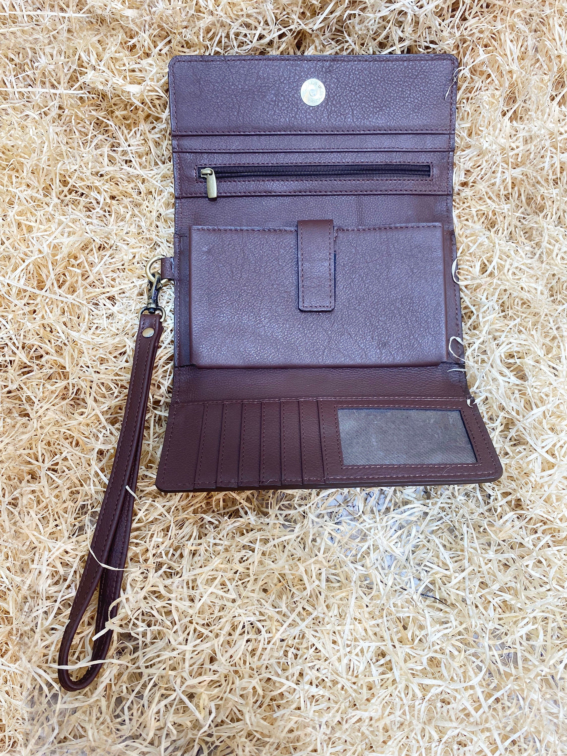 ladies clutch bag comes with real cow hairon overlay. Western Ladies hand clutch bag | Premium leather clutch bag by Mousm