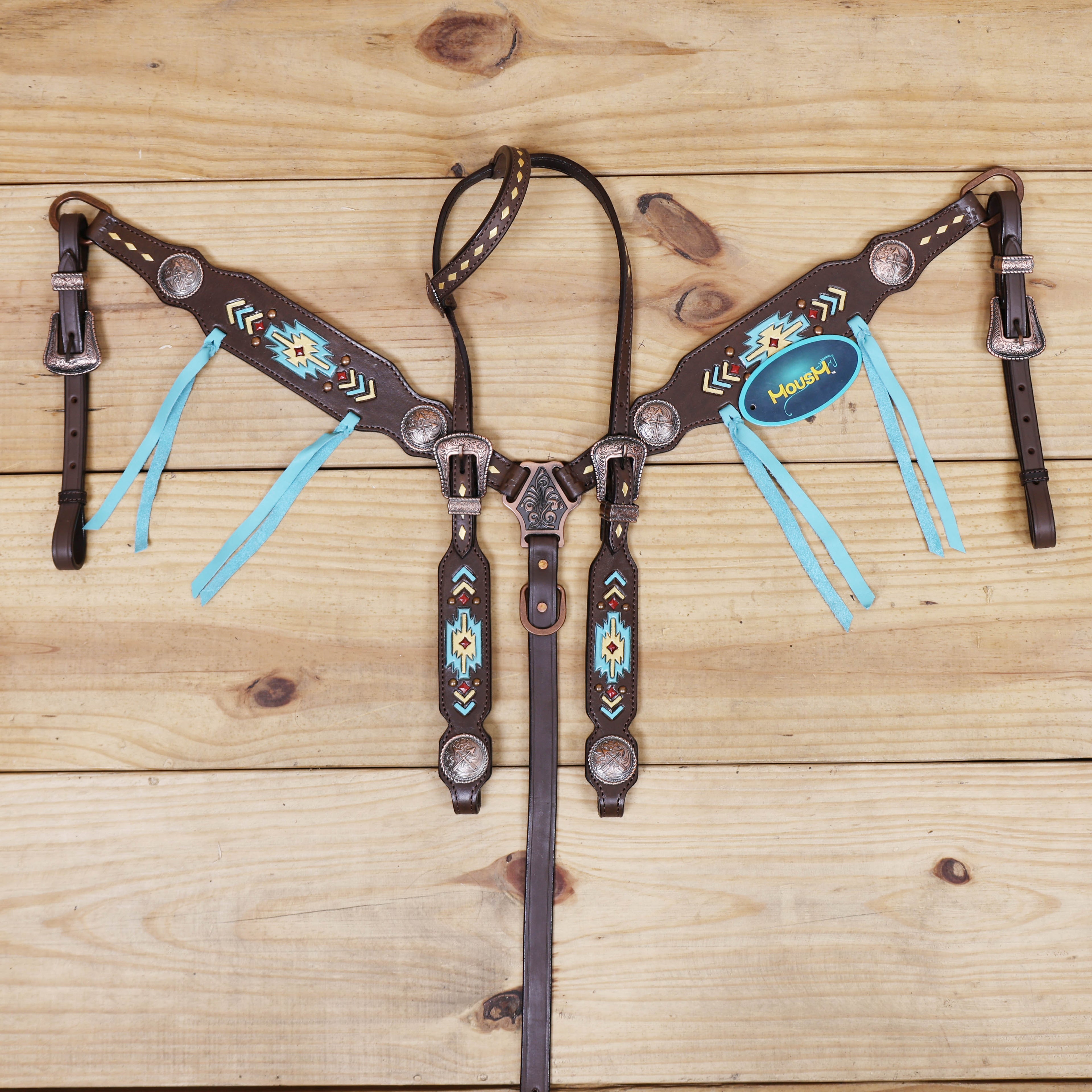 geometrical tooling across the one ear and cheekpieces, beautifully detailed with hand-applied golden and turquoise paint