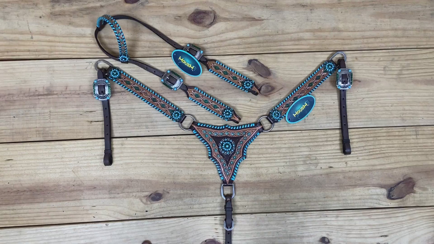 western headstall and breast collar set featuring hand tooling and painting along with whip stitching on edges