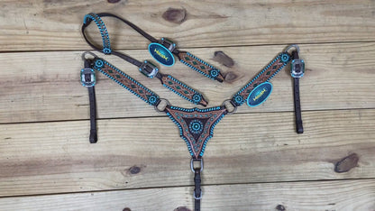 western headstall and breast collar set featuring hand tooling and painting along with whip stitching on edges