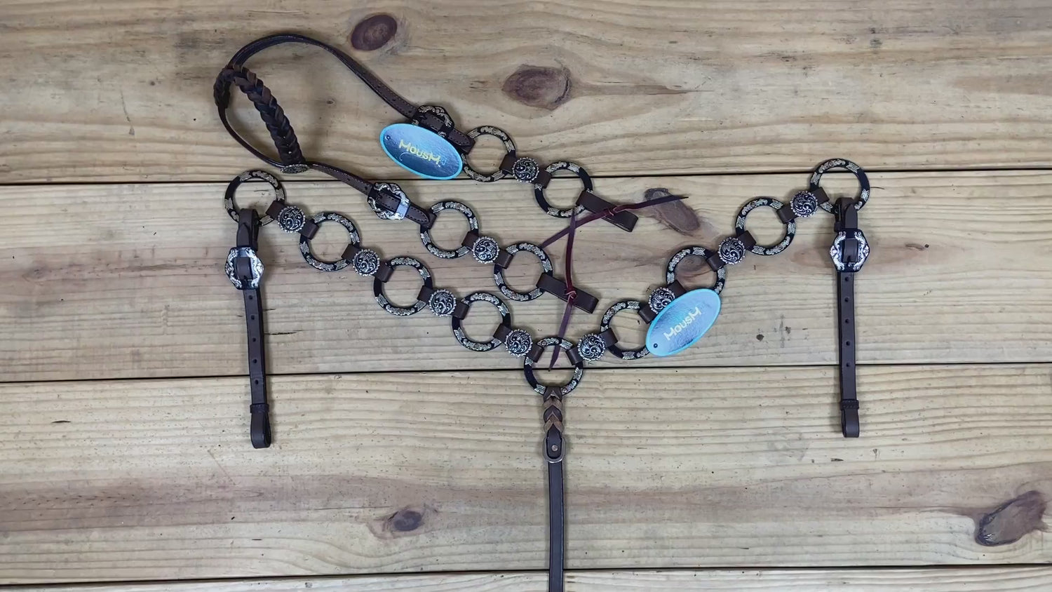 brown argentina cow leather headstall and breast collar with braided one-ear style and engraved nickel rings details