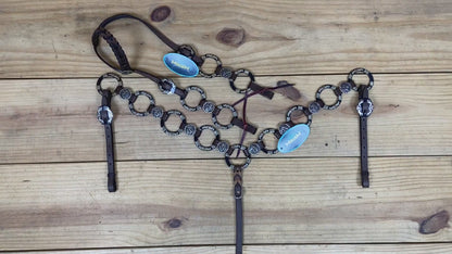 brown argentina cow leather headstall and breast collar with braided one-ear style and engraved nickel rings details