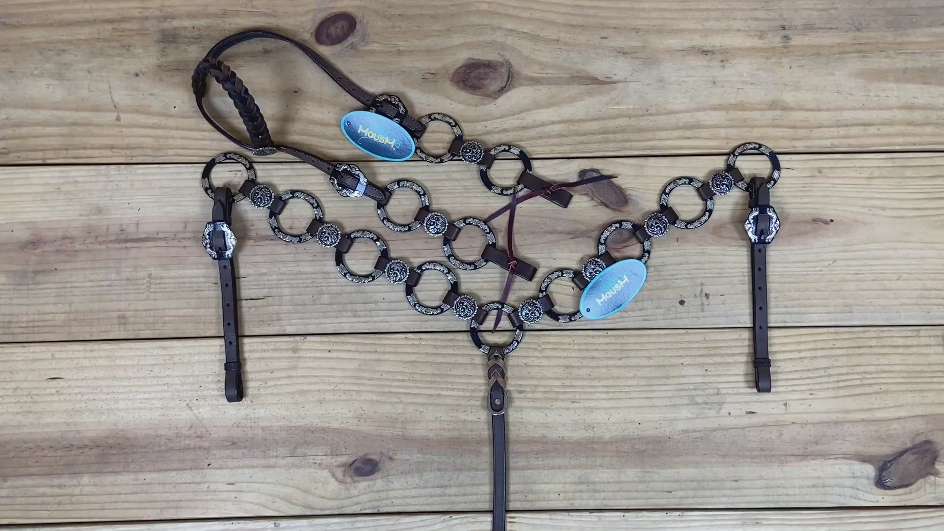 brown argentina cow leather headstall and breast collar with braided one-ear style and engraved nickel rings details